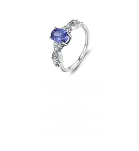 Detailed macro view of S925 silver ring featuring oval purple gemstone and side zircons
