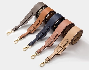 Detail view of adjustable cowhide leather purse straps in five colors with gold buckles