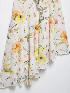 Detail of yellow floral chiffon fabric with irregular hemline and butterfly prints