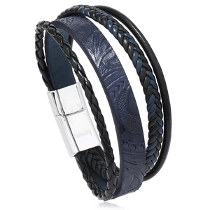 Close-up of men's multilayered black and blue braided leather bracelet with magnetic clasp