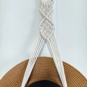 Boho macrame wall hanging hat organizer handcrafted with cotton rope and wood ring
