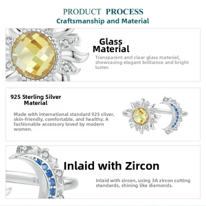 Detail of adjustable S925 silver sun and moon ring with faceted glass and blue zircon