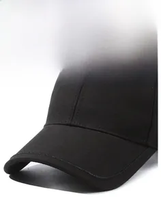 Detail shot of black cotton baseball cap showing sturdy brim and reinforced stitching