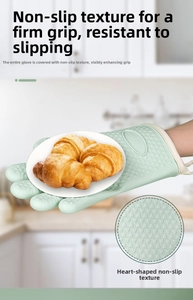 Detail of mint green silicone glove with heart-shaped anti-slip texture holding a pastry tray