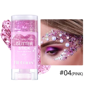 Macro detail of #04 pink glitter stick with star shapes for face, hair and body makeup