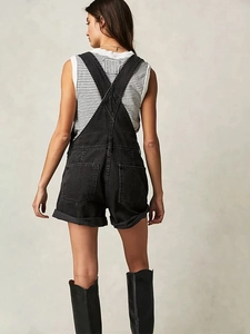 Women's loose black denim overalls featuring multi-pockets and a cross-back strap design