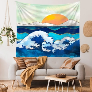 Detail of Great Wave tapestry with red sun and snow mountain over a grey sofa