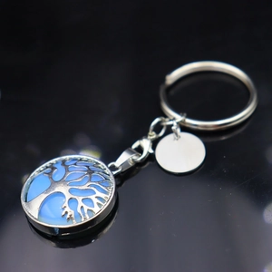 Tree of Life keychain featuring a round blue gemstone pendant with a silver metal frame