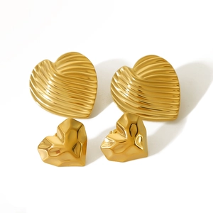 Golden stainless steel lava heart tassel earrings with striped texture and geometric facets