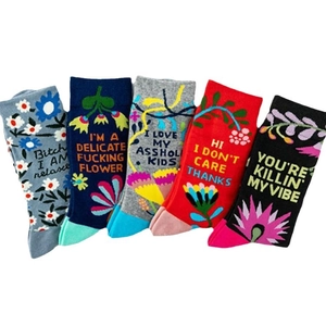 Funny slogan crew socks with colorful floral patterns and humorous English quotes