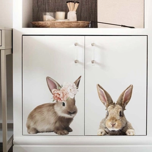 Detailed view of cute realistic rabbit wall stickers applied on white cabinet doors