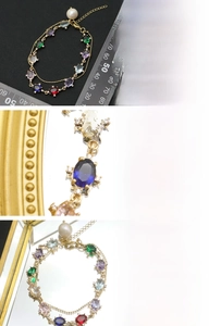 Macro view of colorful gemstone beads and natural freshwater pearl on 18K gold plated chain