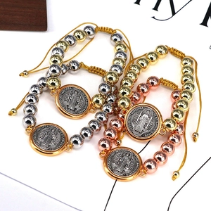 Adjustable Saint Benedict medal woven bracelet with gold and silver copper beads