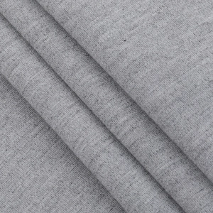 Close-up of grey cotton blend fabric showing detailed weave texture and soft diagonal folds