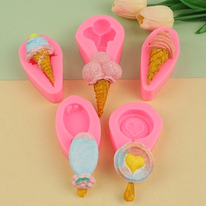 Macro detail of pink silicone molds and finished ice cream shaped fondant desserts