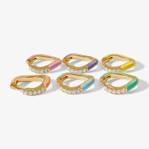 Detail of S925 silver gold-plated huggie earrings with colorful enamel and cubic zirconia
