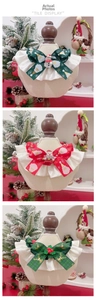 Detailed close-up of festive pet Christmas bow collars with lace trim and reindeer charms