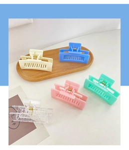 Detailed view of candy-colored rectangular hollow hair claws in various pastel matte finishes