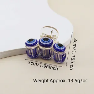 Detail view of Evil Eye hair claw clip with dimensions 5cm length and 13.5g weight
