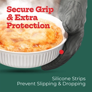 Detail of gray silicone oven mitt holding a hot tray with wavy anti-slip texture