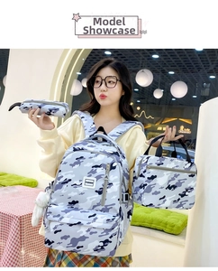 Three-piece set featuring camouflage backpack, lunch bag and pencil case with FASHION logo