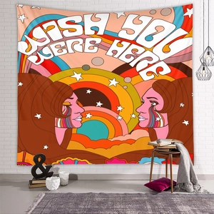 Retro psychedelic tapestry featuring Wish You Were Here text on a white brick wall