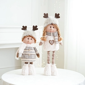 Cute reindeer plush dolls for Christmas decor standing on a table in a cozy home setting