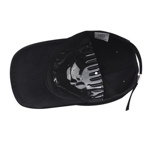 Detail view of cotton baseball cap interior featuring a plastic shape support and wash label