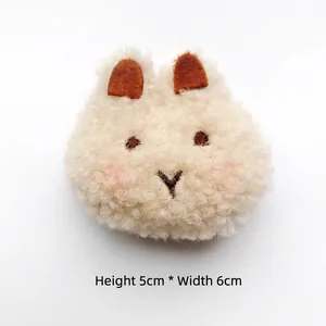 Close-up of cute plush rabbit accessory with detailed embroidery measuring 5cm by 6cm