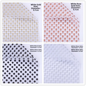 Detailed comparison of four polka dot tissue paper styles in gold, rose gold, black, and silver