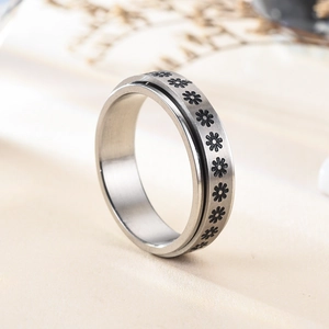 Celestial spinner ring set in silver stainless steel with engraved sun and moon patterns