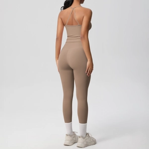 Detail view of coffee brown sports yoga set featuring a crisscross back and high waist leggings