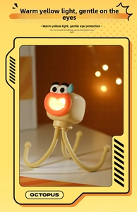 Mini octopus night light with warm LED glow and flexible adjustable legs on a table