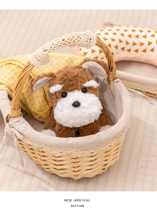 Realistic Schnauzer plush toy dog sitting in a woven basket with a cozy home background