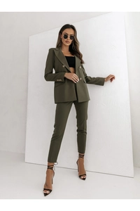 Detailed view of olive green double-breasted blazer and slim fit trousers set