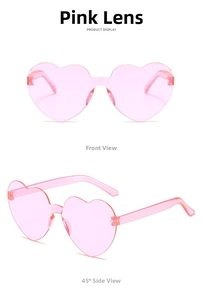 Close-up detail of rimless heart-shaped sunglasses in translucent pink jelly color