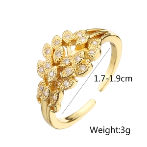 Macro shot of 18K gold plated leaf ring with white zircon details and 3g weight mark