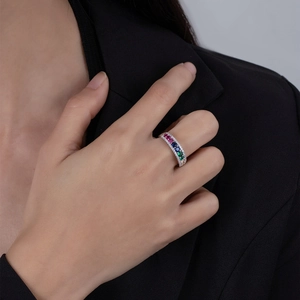 Detailed view of 925 silver rainbow gemstone ring with multi-color stones on finger