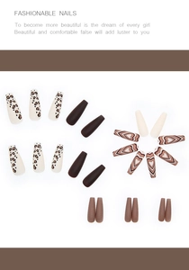 Detail of coffin shape press-on nails with leopard print and brown heart patterns