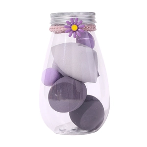 Purple makeup sponge set in a transparent jar with floral decoration and silver lid