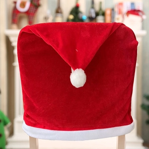 Classic red velvet Christmas chair cover with white plush trim and pom pom detail
