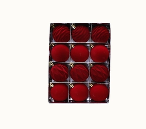 Detail of red velvet and wave-textured Christmas balls in a 12-piece decorative set