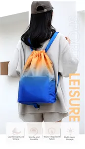 Waterproof drawstring backpack in gradient orange and blue shown on a model