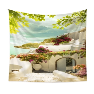 Detailed fabric texture of Mediterranean landscape tapestry hanging on a white wall