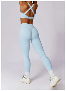 Detail view of high-waist yoga set with crisscross back sports bra and lifting leggings