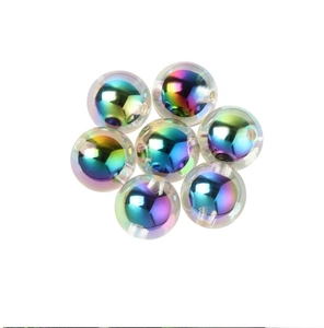 Macro shot of 7 iridescent AB acrylic round beads for handmade DIY jewelry crafting