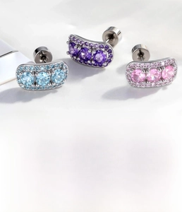 Macro detail of three-color zircon stud earrings set with titanium steel measurements