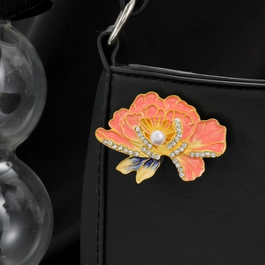 Elegant peony flower pearl brooch with pink gradient enamel and crystals on black bag