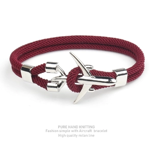 Detailed view of hand-knitted burgundy Milan cord bracelet with silver aircraft buckle