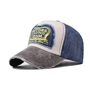 Detail of vintage racing baseball cap with MOTORS embroidery and distressed wash fabric